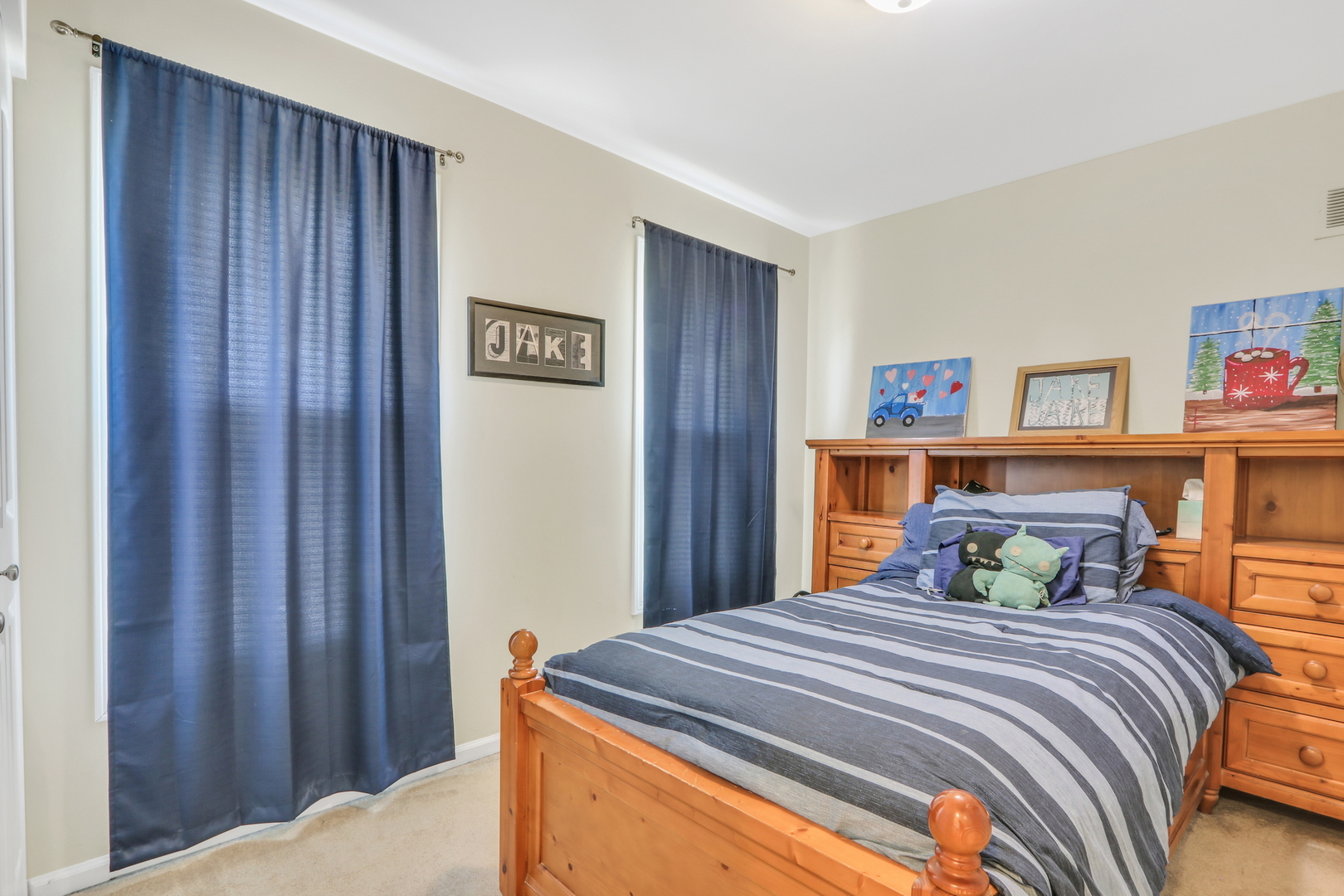 1215 Devonshire Road Buffalo Grove, IL 60089 - Photo 24 of 36 a bedroom with a bed and a book shelf