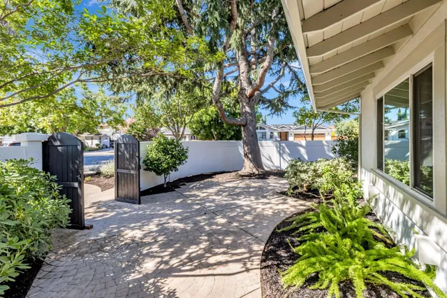 a backyard of a house with lots of green space