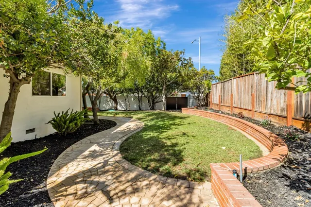 a view of a backyard with a small cabin