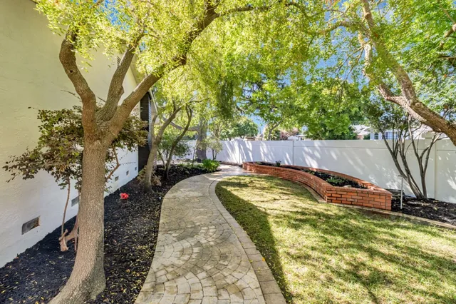 swimming pool with large trees