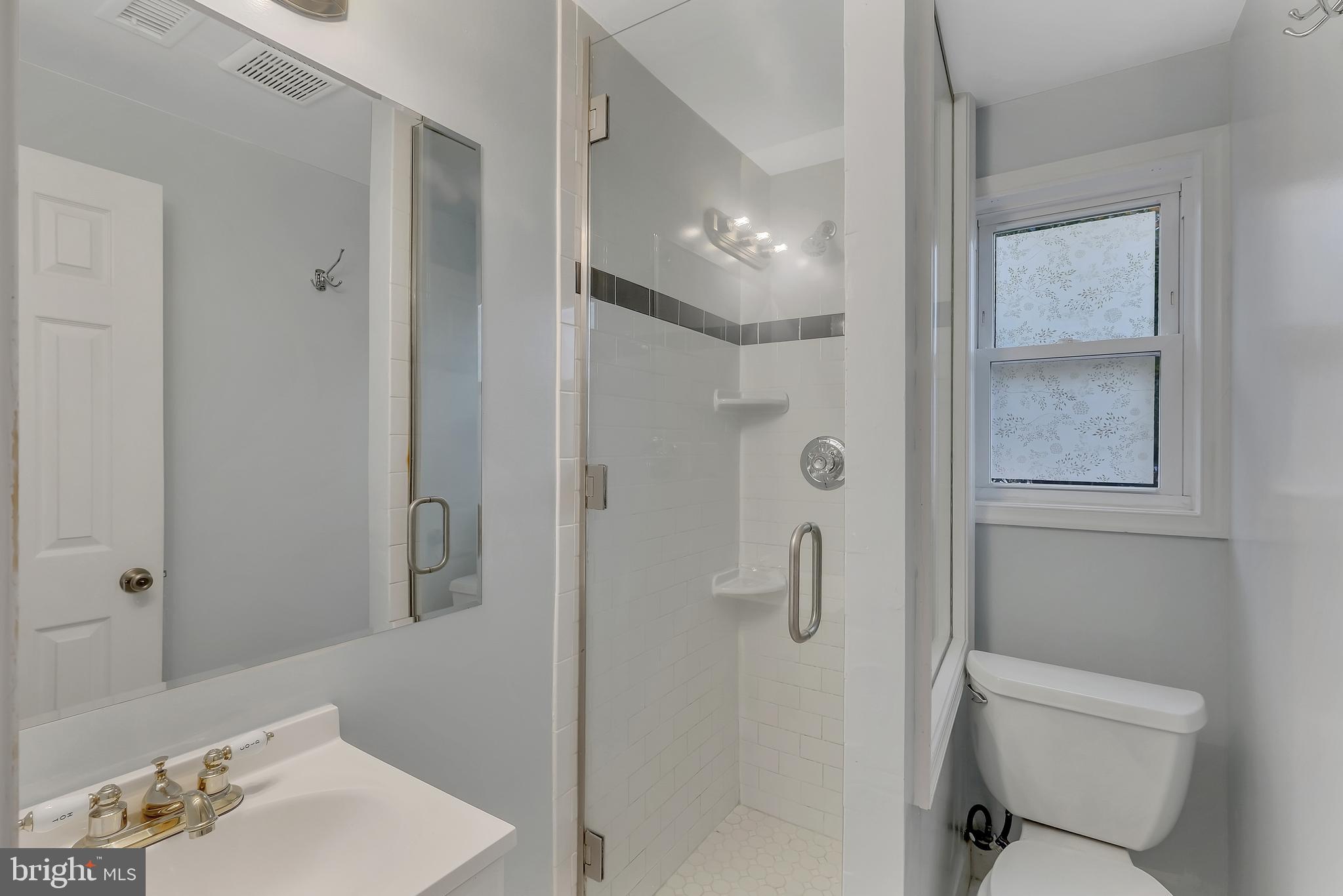 4205 Ferrara Drive Silver Spring, MD 20906 - Photo 9 of 38 a bathroom with a sink toilet and shower