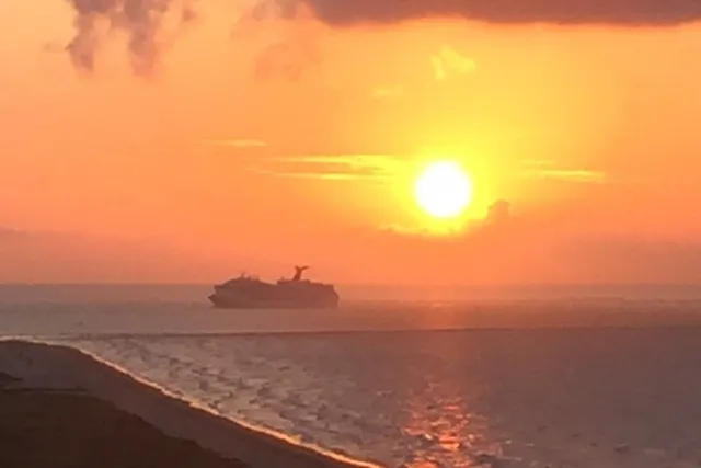 a view of a lake from a balcony