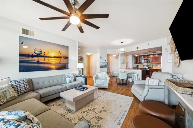 a kitchen with a sink refrigerator and cabinets