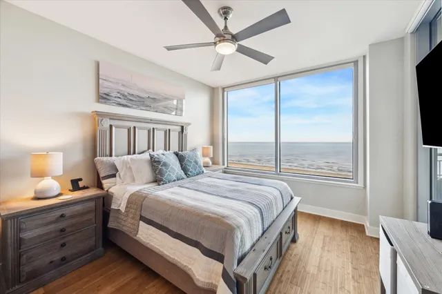 a bathroom with a granite countertop sink mirror and shower
