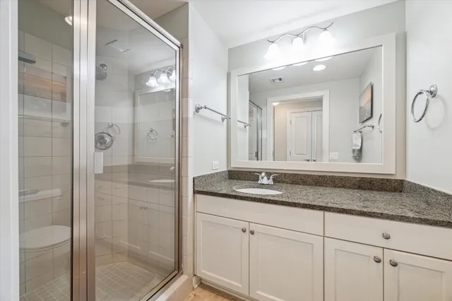a bedroom with furniture and a flat tv screen