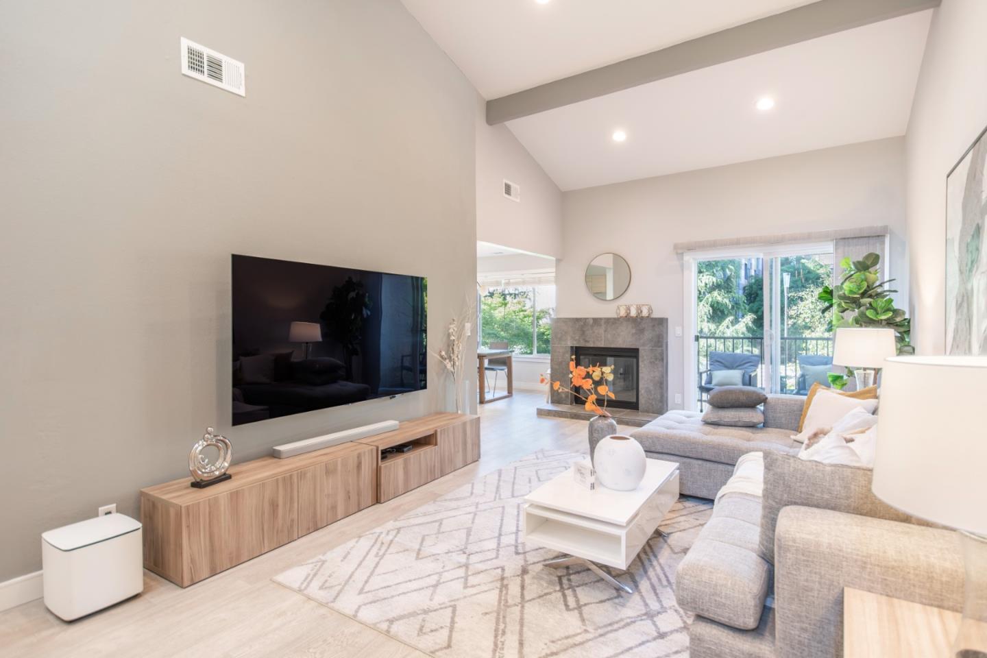 3679 Brach Way Santa Clara, CA 95051 - Photo 1 of 1 a living room with furniture a flat screen tv and a fireplace