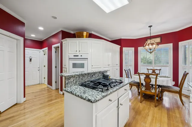 a kitchen with a sink cabinets and window