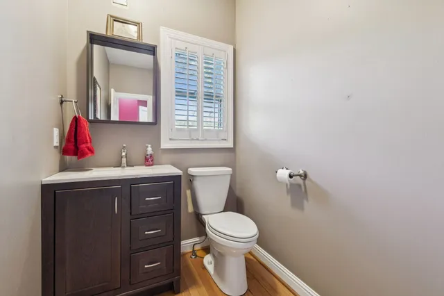 a bathroom with a tub sink shower and mirror
