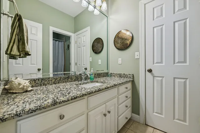 a dining room with wooden floor and outdoor space