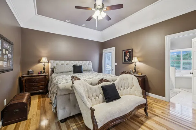 a view of a patio with a table and chairs and potted plants