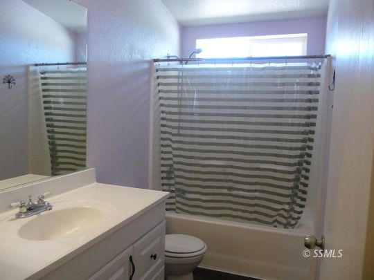 770 Alpine Way Ridgecrest, CA 93555 - Photo 42 of 50 a bathroom with a sink a toilet and shower