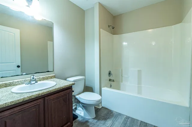 a spacious bedroom with a bed and a window