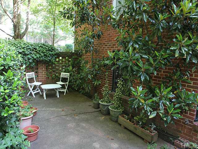 1031 Harvey Street Raleigh, NC 27608 - Photo 11 of 12 a view of a bench in a garden