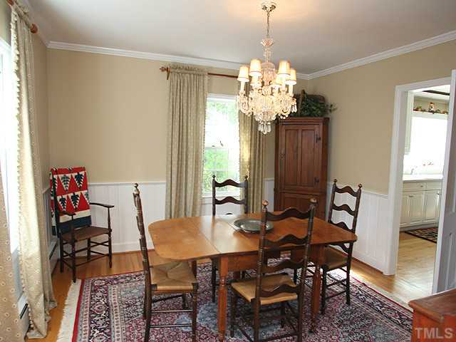 1031 Harvey Street Raleigh, NC 27608 - Photo 4 of 12 a view of a dining room with furniture and a chandelier