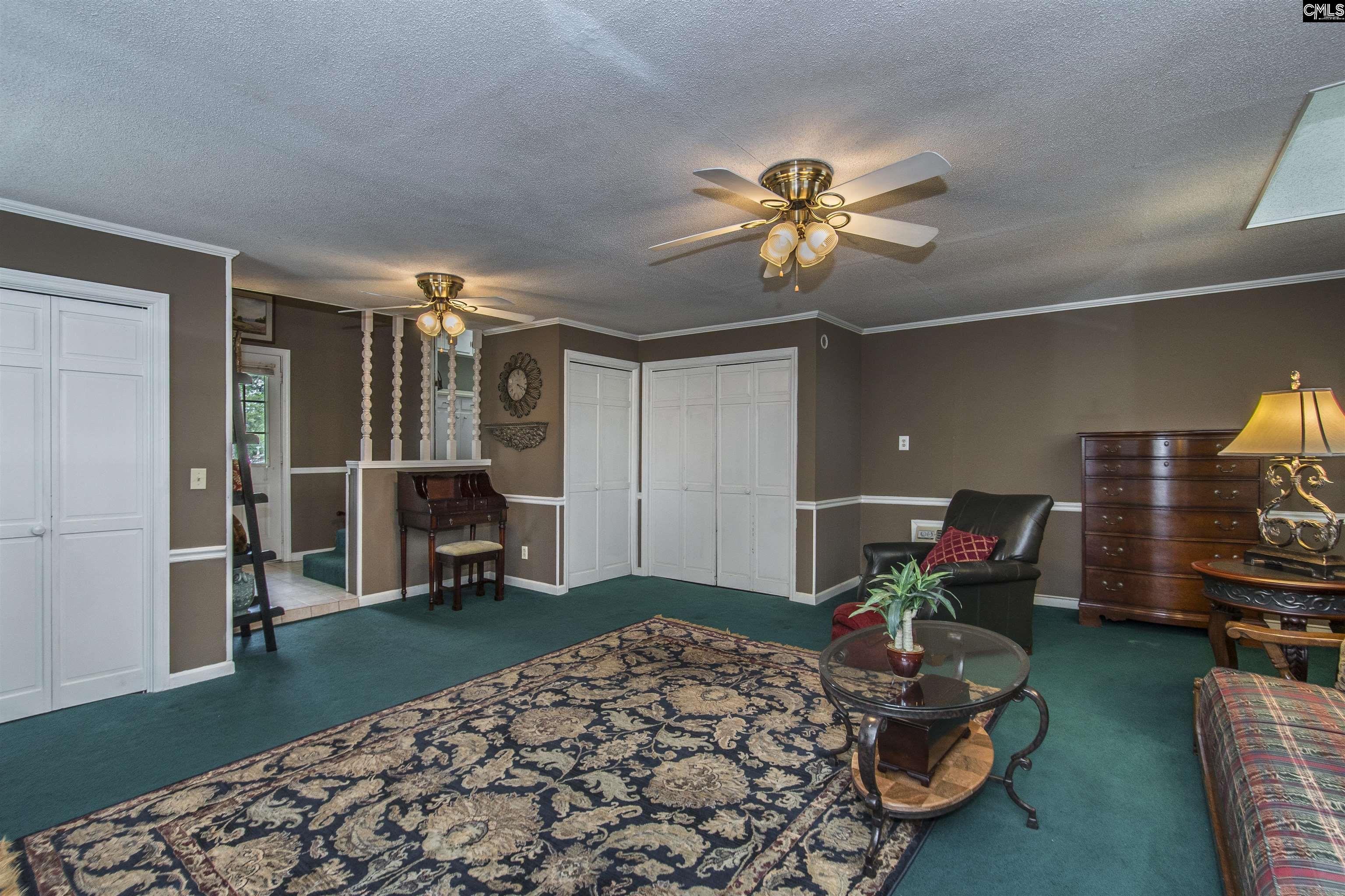 2309 Cunningham Road Columbia, SC 29210 - Photo 34 of 41 a bed room with a bed and a chair