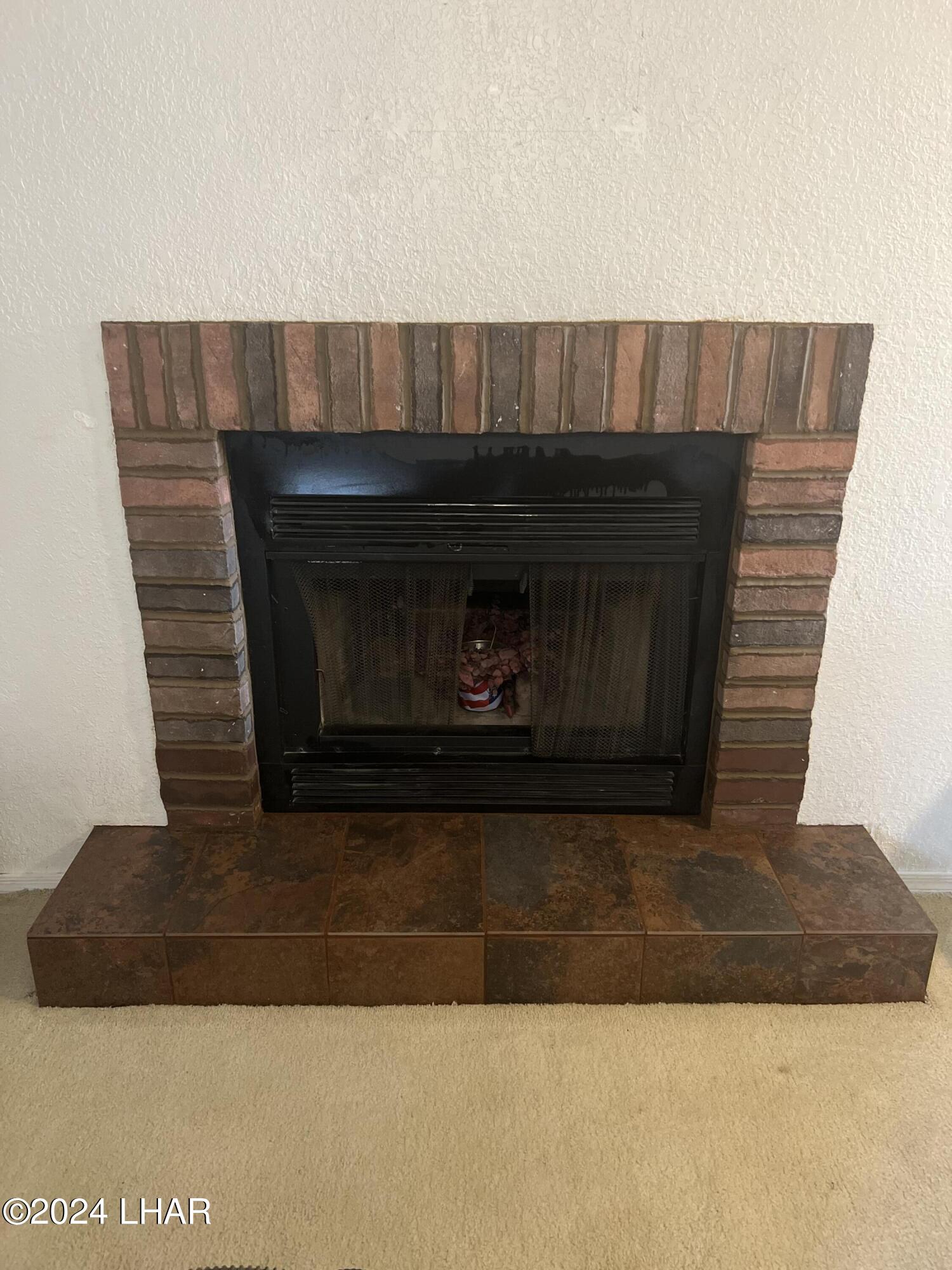 8625 Riverside Drive, Unit 70 Parker, AZ 85344 - Photo 17 of 29 retiled fireplace