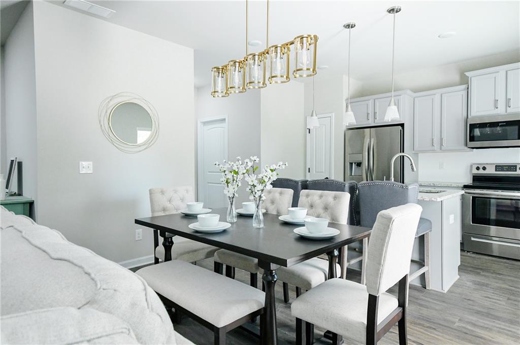2288 Elsie Way Hampton, GA 30228 - Photo 17 of 45 a view of a dining room with furniture