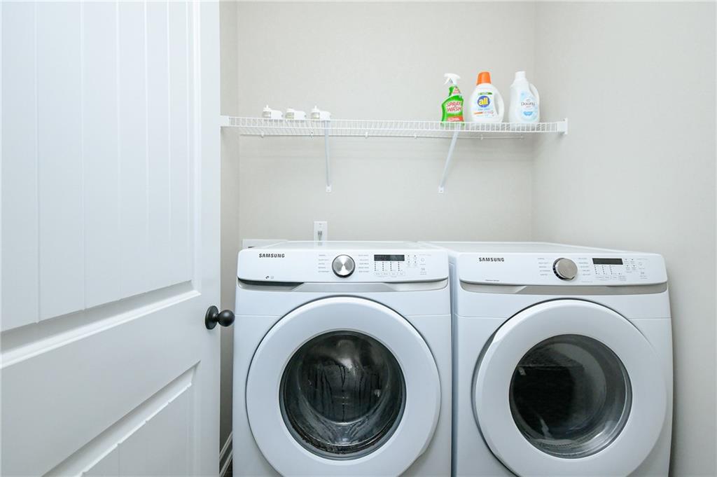 2288 Elsie Way Hampton, GA 30228 - Photo 20 of 45 a utility room with dryer and washer