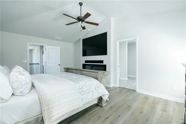 a living room with a fireplace and a flat screen tv