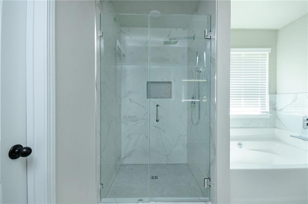 2288 Elsie Way Hampton, GA 30228 - Photo 28 of 45 a bathroom with a shower