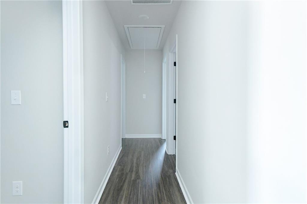 2288 Elsie Way Hampton, GA 30228 - Photo 30 of 45 a view of a hallway with wooden floor
