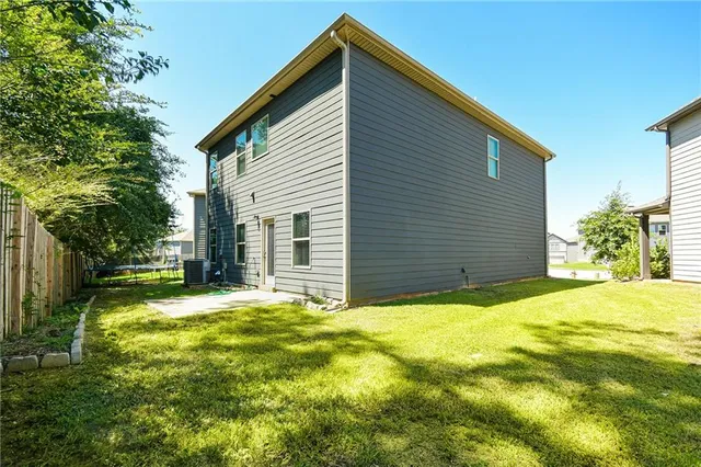 a view of backyard with green space