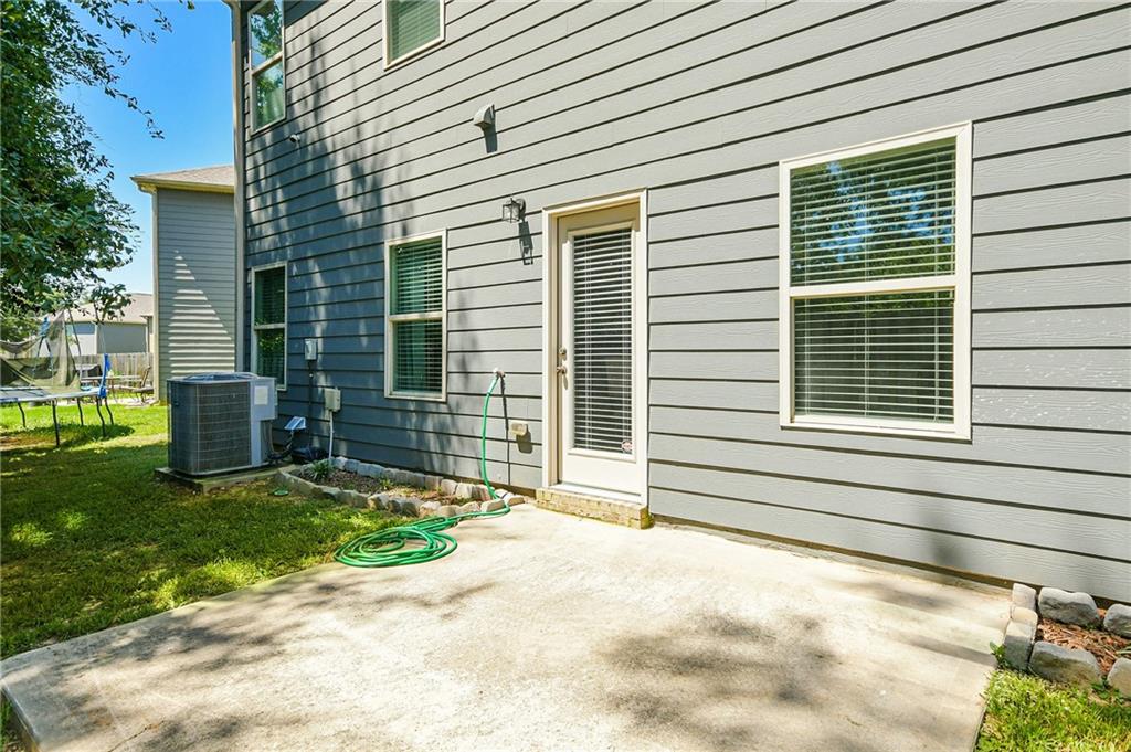 2288 Elsie Way Hampton, GA 30228 - Photo 37 of 45 a front view of a house with a yard and garage