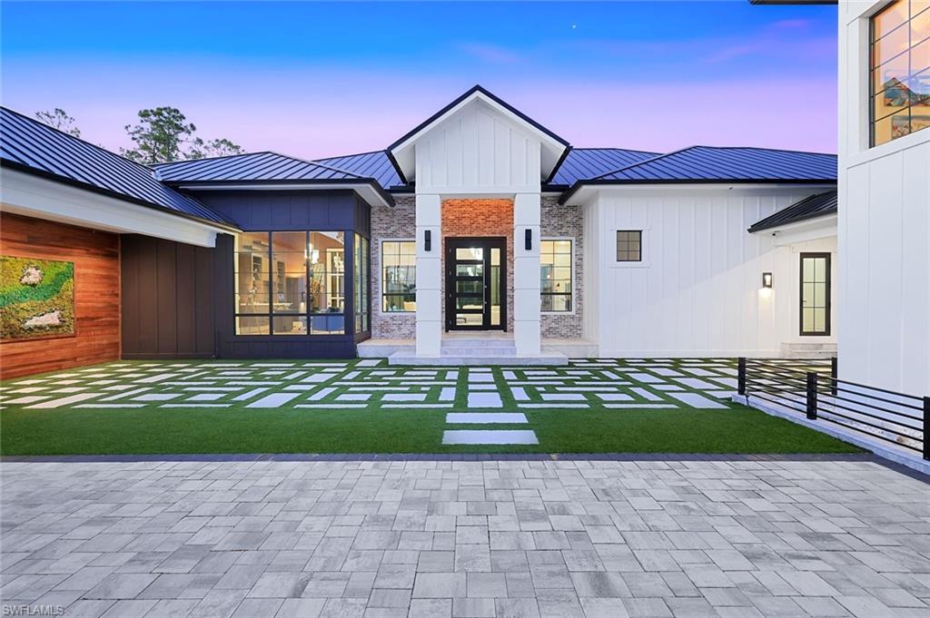 6677 Hunters Road Naples, FL 34109 - Photo 5 of 50 a view of front a house with a yard