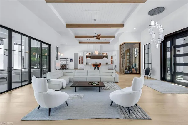 a room with furniture and a large mirror