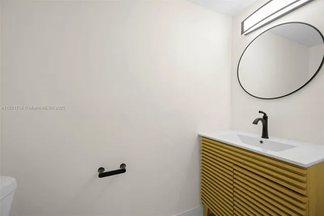 a bathroom with a sink and mirror
