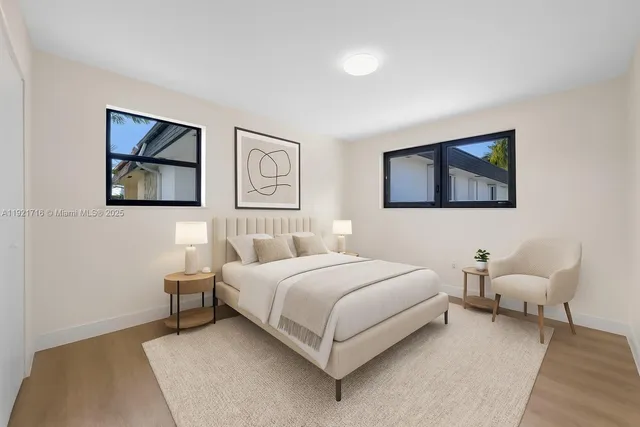 a bedroom with a bed and a couch