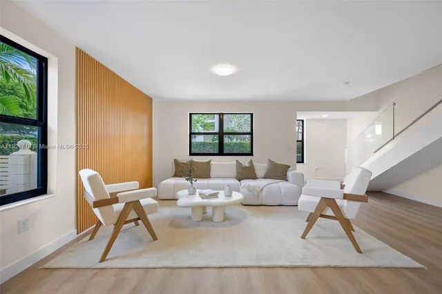 a living room with a couch and a window