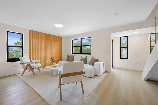 a living room with furniture and window