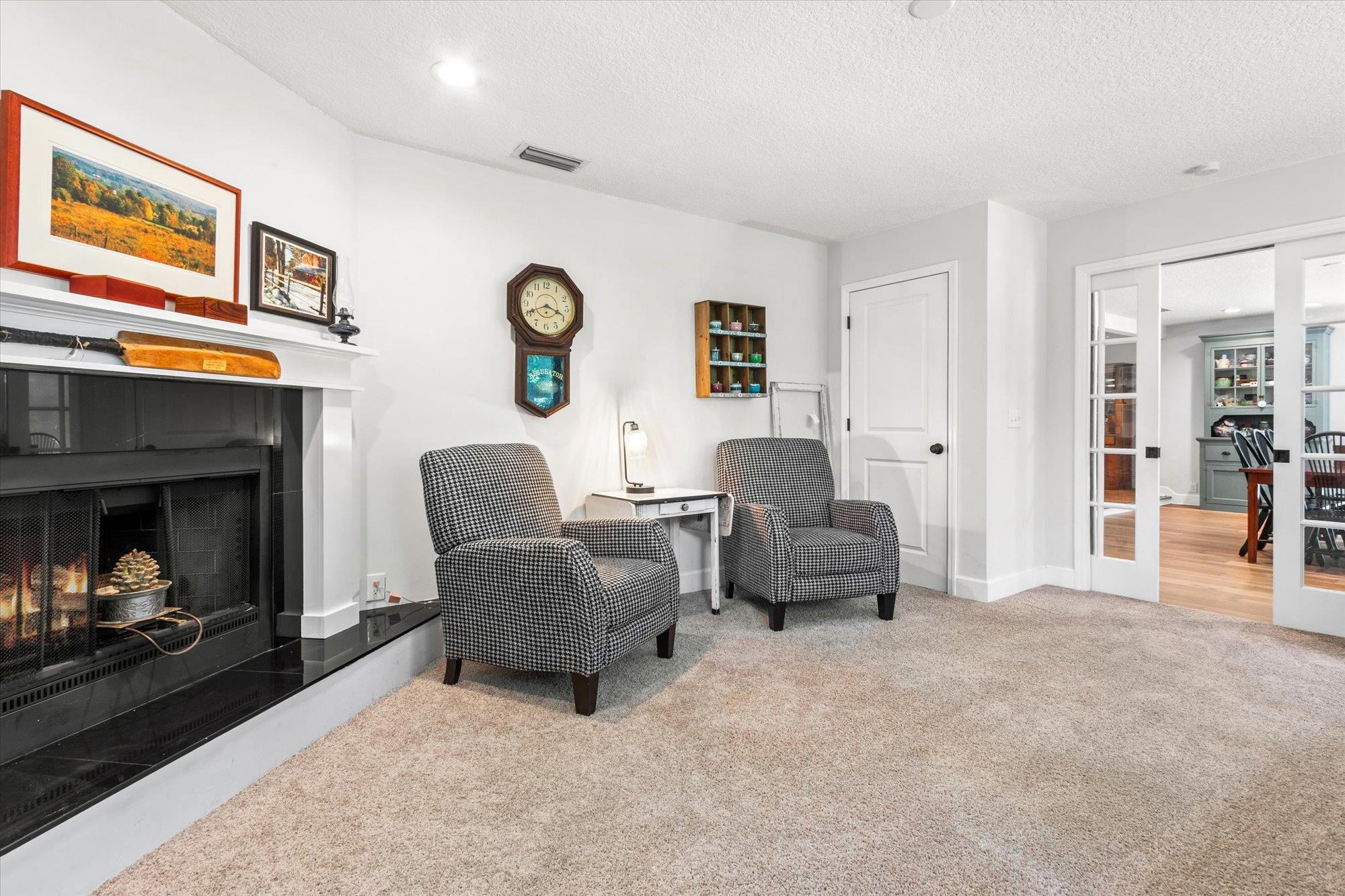 200 Raintree Trail St. Augustine, FL 32086 - Photo 11 of 36 a living room with furniture and a fireplace