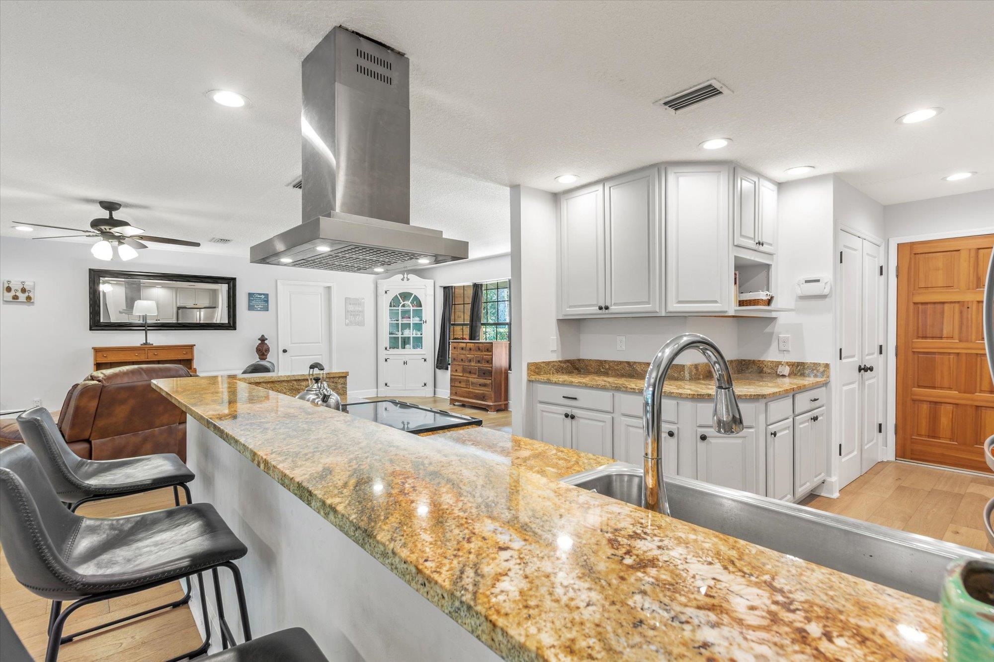 200 Raintree Trail St. Augustine, FL 32086 - Photo 16 of 36 a kitchen with stainless steel appliances granite countertop a sink and cabinets