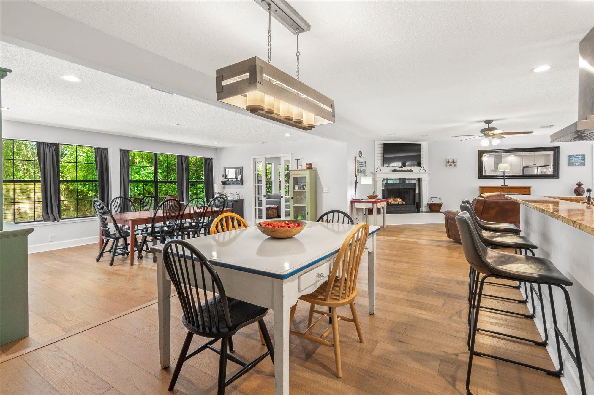 200 Raintree Trail St. Augustine, FL 32086 - Photo 18 of 36 a dining room with furniture a chandelier and wooden floor