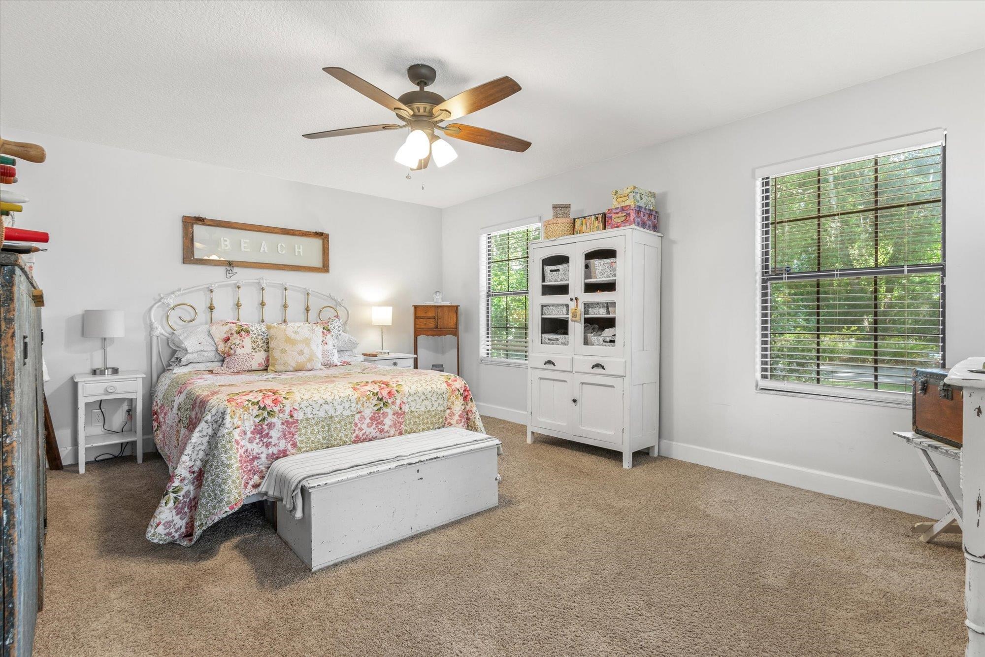 200 Raintree Trail St. Augustine, FL 32086 - Photo 23 of 36 a bedroom with a large bed and a window