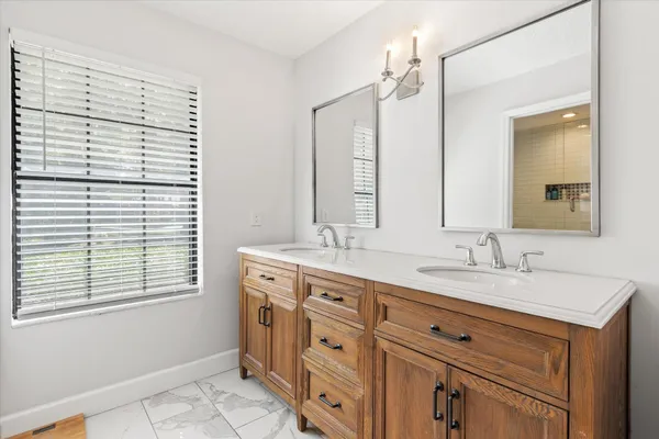 a bathroom with a sink a vanity and a mirror