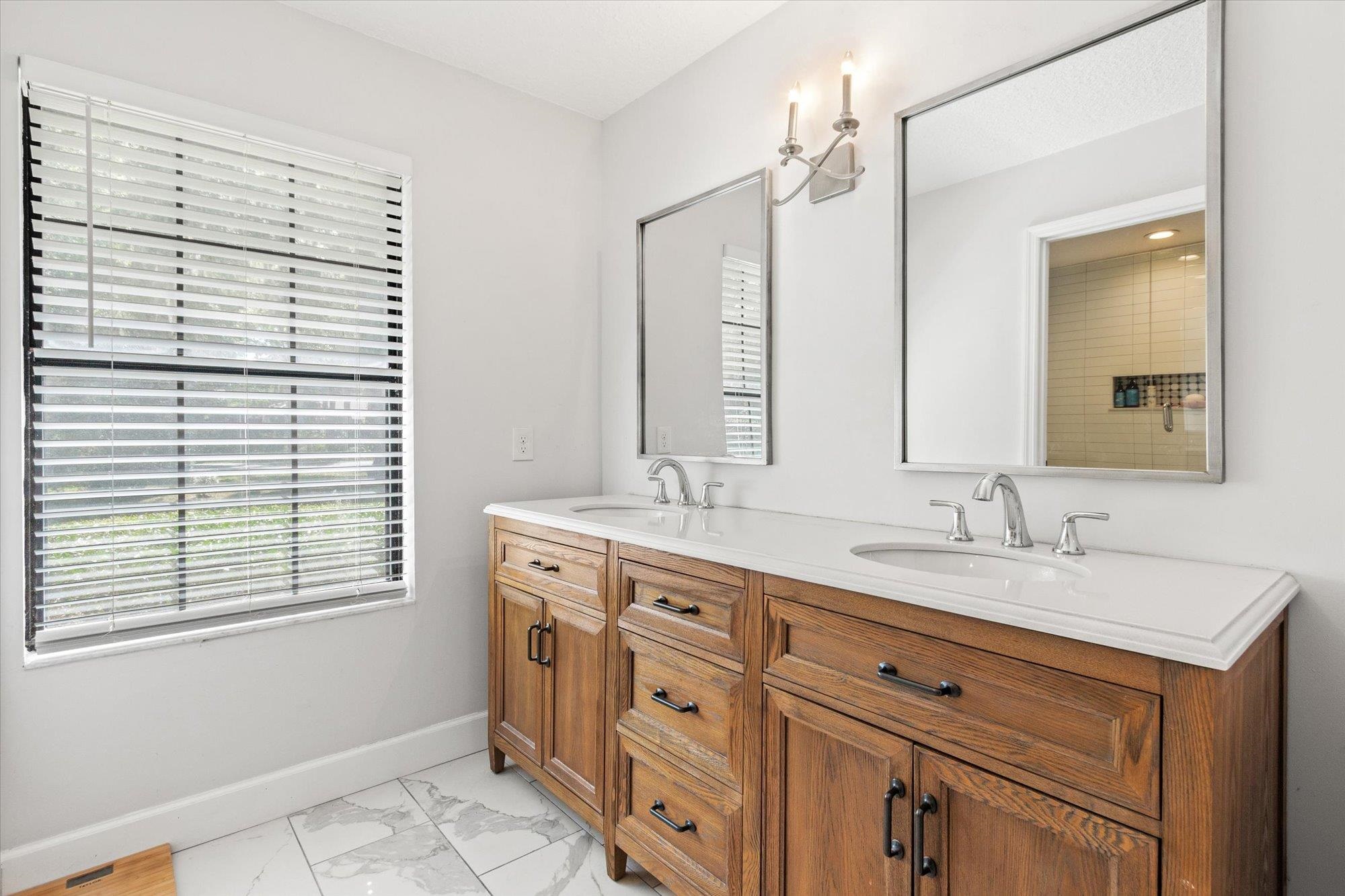 200 Raintree Trail St. Augustine, FL 32086 - Photo 26 of 36 a bathroom with a sink a vanity and a mirror