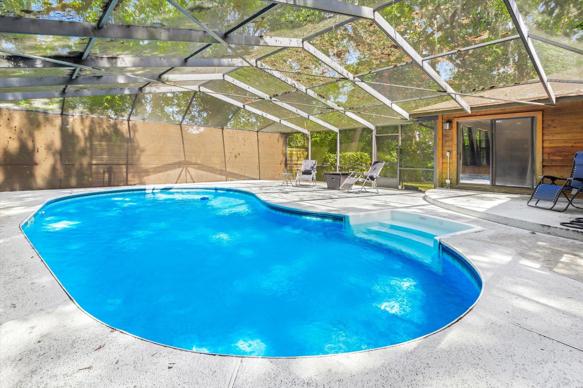 200 Raintree Trail St. Augustine, FL 32086 - Photo 8 of 36 a view of a swimming pool with a patio