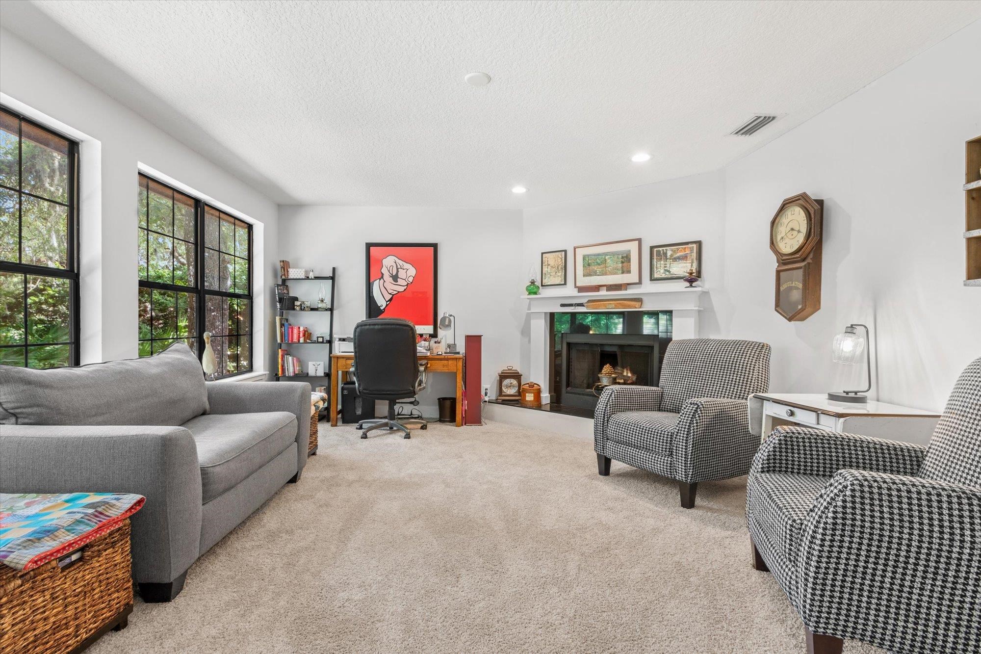 200 Raintree Trail St. Augustine, FL 32086 - Photo 10 of 36 a living room with furniture and a fireplace