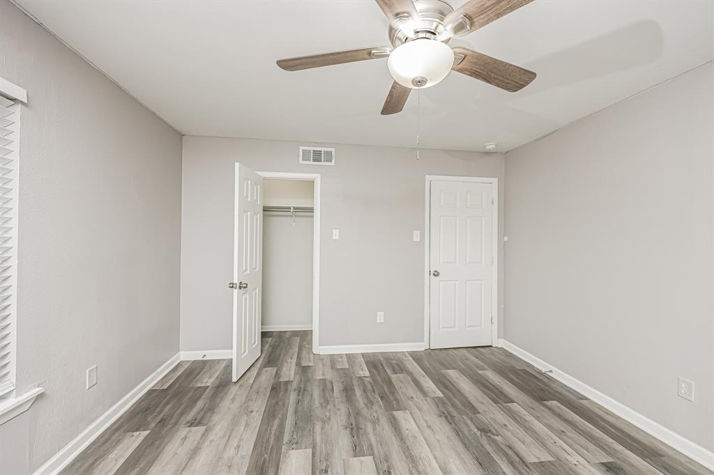 2155 Gaylord Drive Dallas, TX 75227 - Photo 15 of 21 wooden floor in an empty room with a window