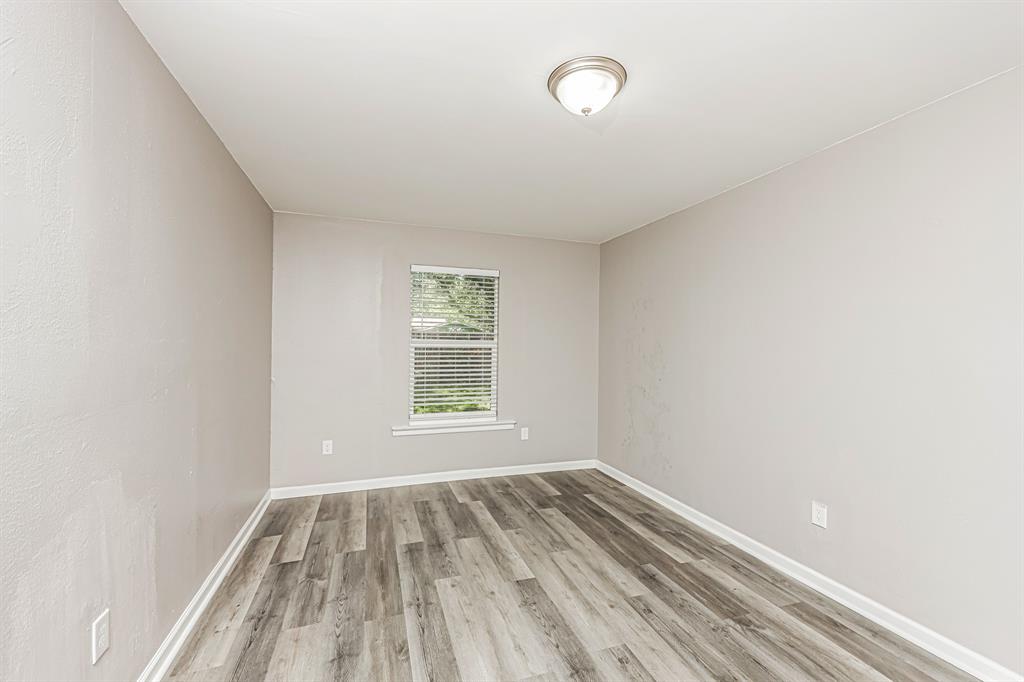 2155 Gaylord Drive Dallas, TX 75227 - Photo 17 of 21 an empty room with a window