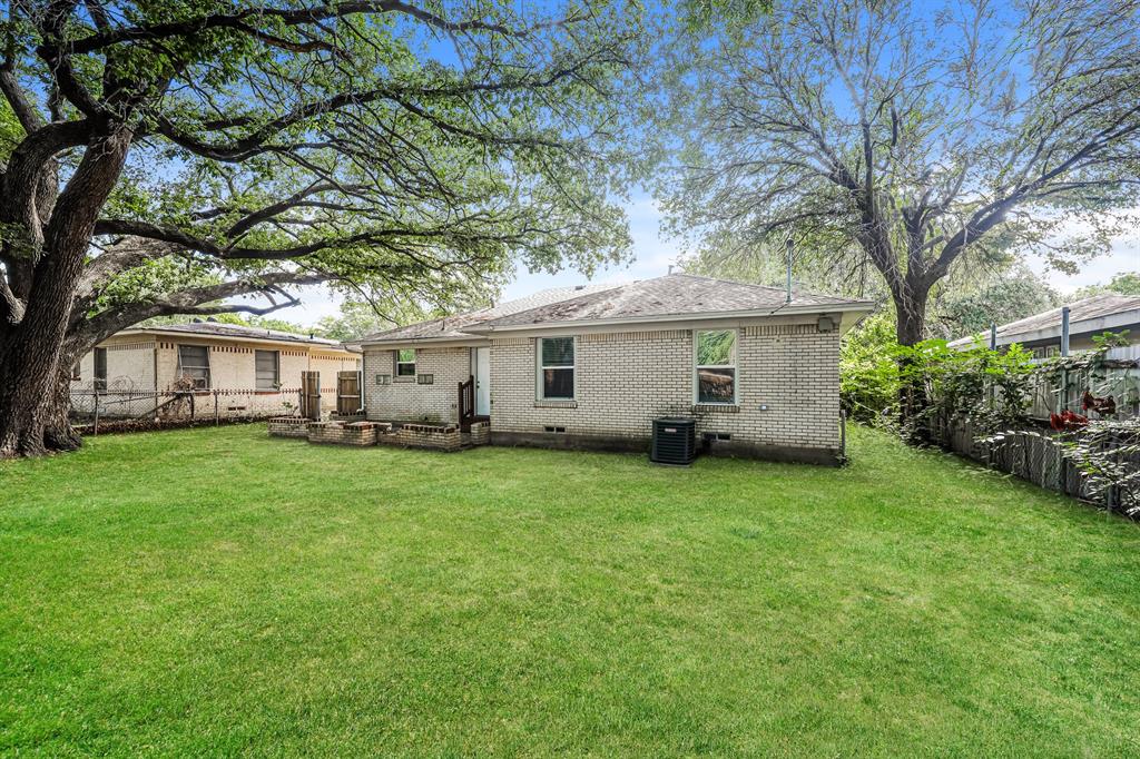2155 Gaylord Drive Dallas, TX 75227 - Photo 20 of 21 a view of a yard with a house and garden