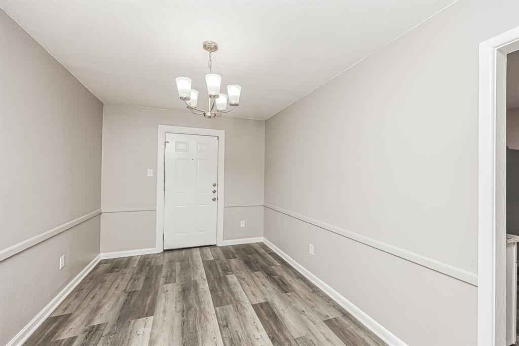 2155 Gaylord Drive Dallas, TX 75227 - Photo 9 of 21 a view of livingroom with hardwood floor and hallway