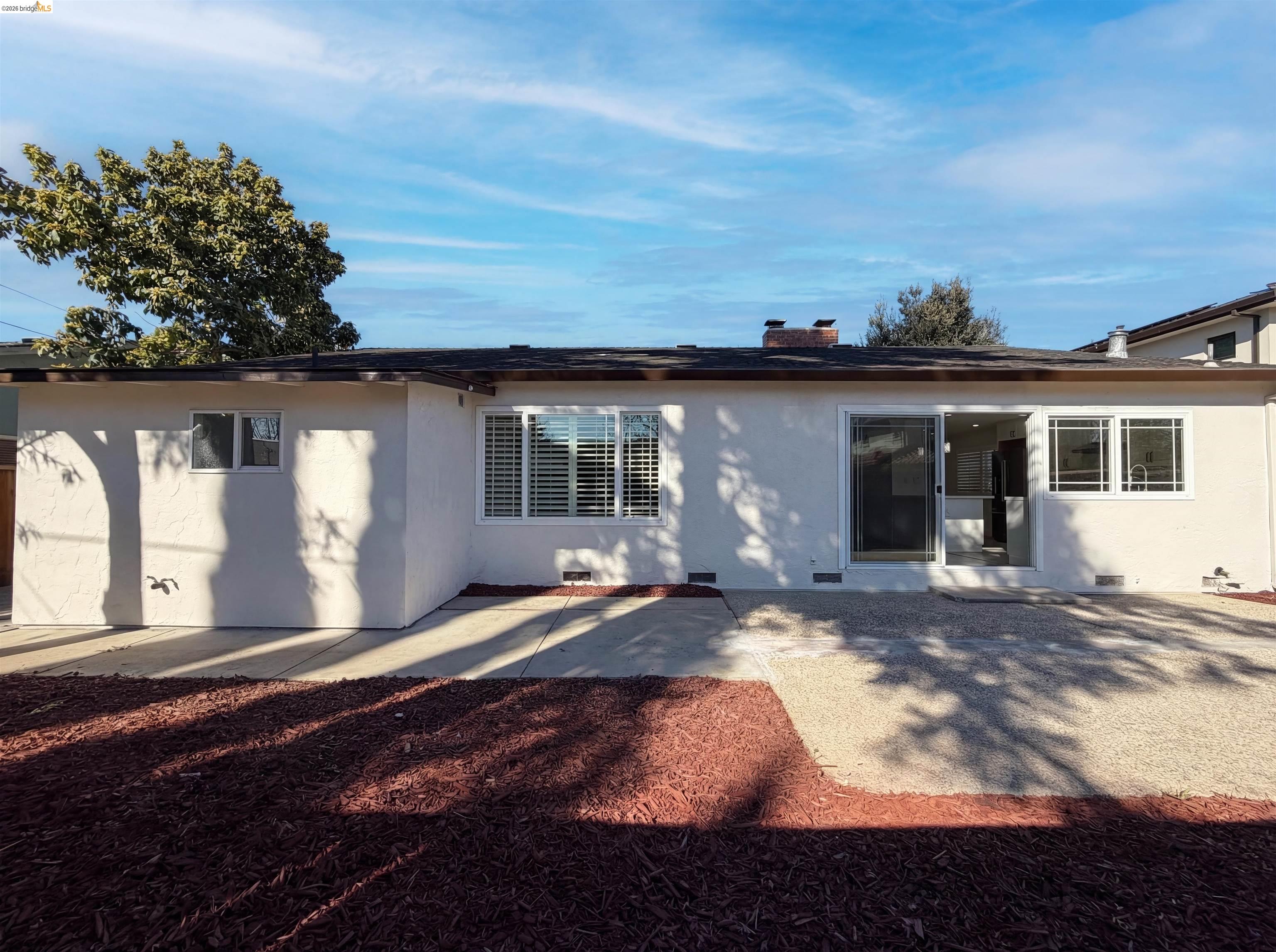 1564 South Wolfe Road Sunnyvale, CA 94087 - Photo 25 of 27 Back of house with a patio, stucco siding, and a chimney