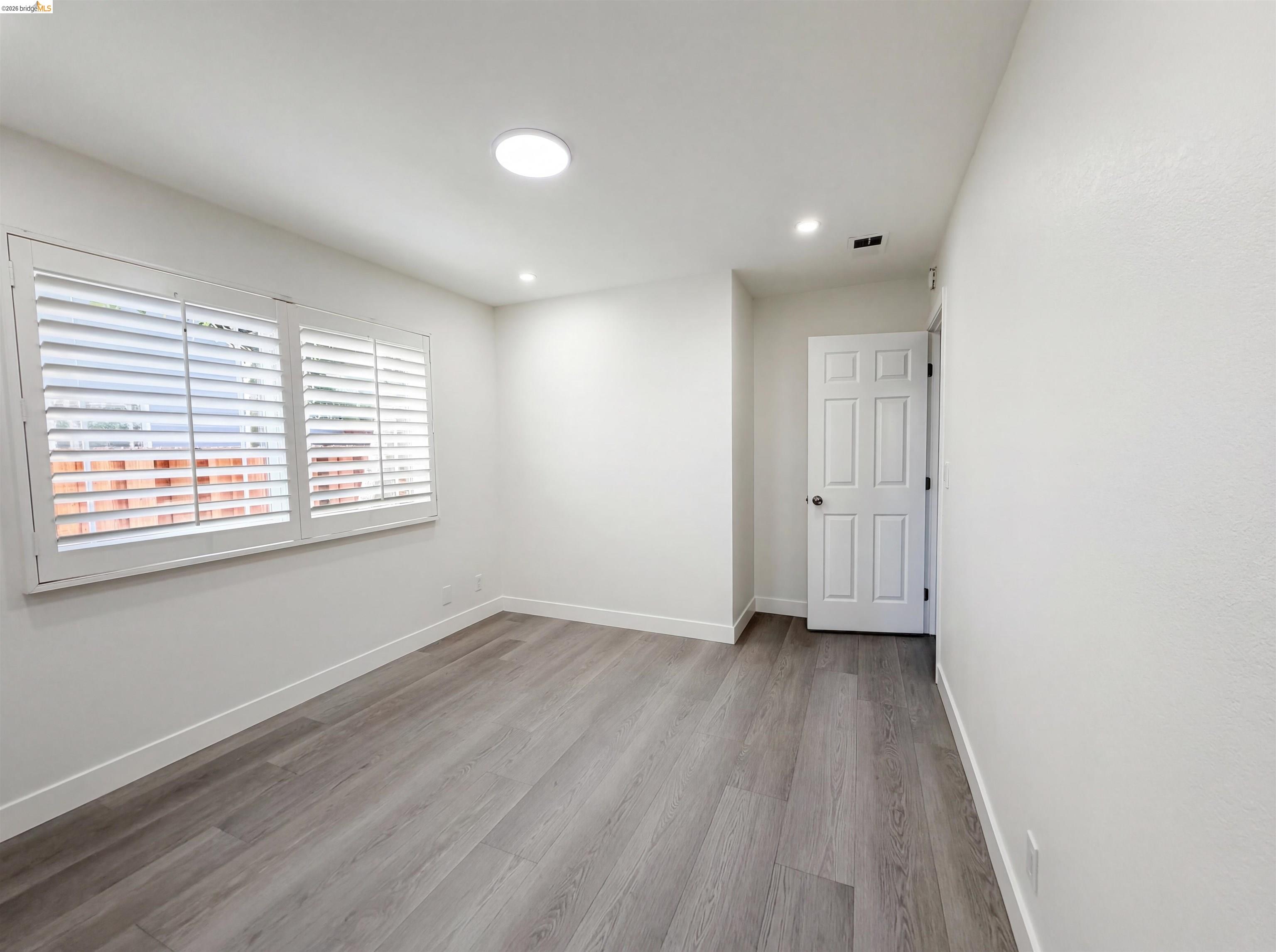 1564 South Wolfe Road Sunnyvale, CA 94087 - Photo 7 of 27 Empty room featuring light wood-style floors and recessed lighting