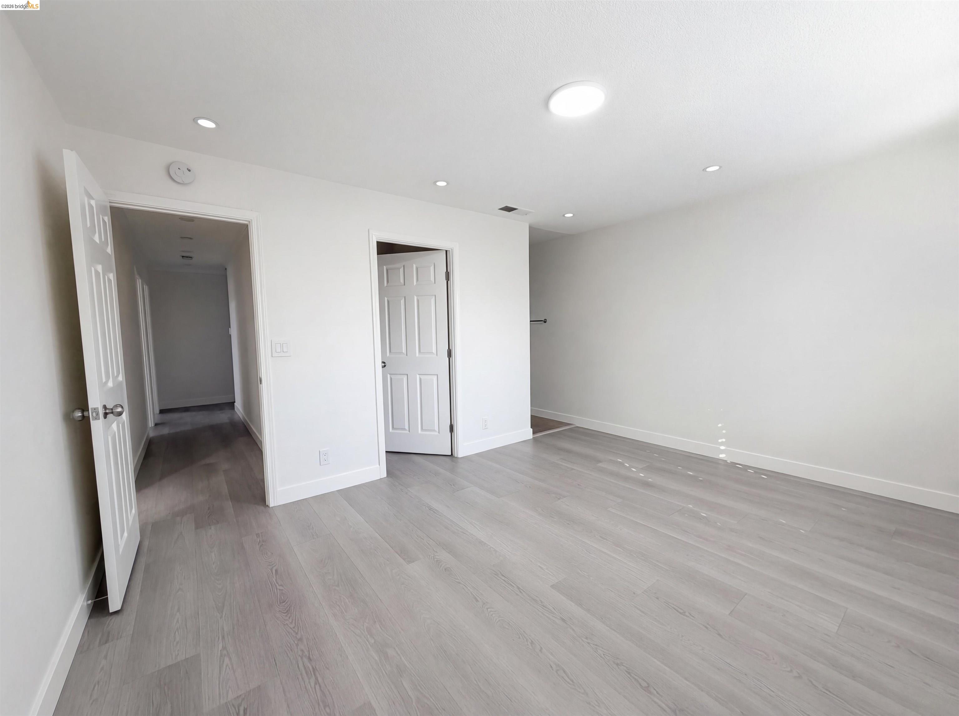 1564 South Wolfe Road Sunnyvale, CA 94087 - Photo 10 of 27 Unfurnished bedroom with light wood-style floors and recessed lighting