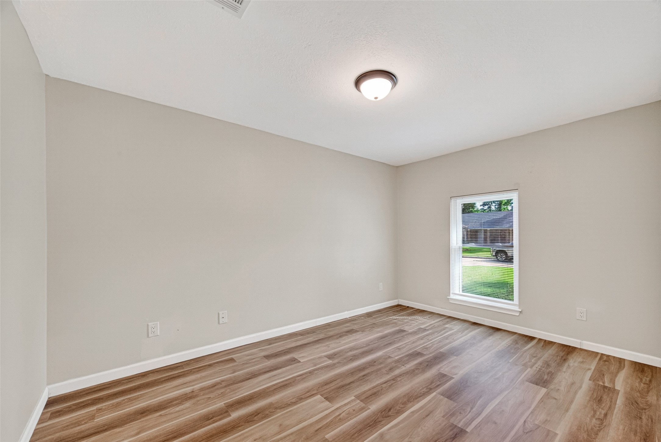 25503 Foxbriar Lane Spring, TX 77373 - Photo 24 of 45 an empty room with wooden floor and windows