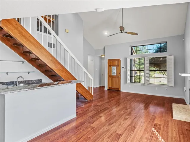 a view of an entryway with wooden floor